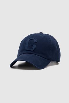 Introducing the newest member of our hats collection, the Tonal Letter Cap Navy, a fresh and subtle take on our best selling Letter Cap. Made from 100% brushed cotton twill in a bespoke fitted style, it features a leather strap that can be adjusted to fit any adult head size, making it suitable for all occasions. Whether you're treating yourself or your loved ones, this is our best selling hat for a reason. 100% Brushed cotton twill Felt letter Navy Adjustable leather strap Navy under peak and b Hats Collection, Navy Hat, Felt Letters, Fitted Style, No Show Socks, Brushed Cotton, Clothing Co, Blue Sea, Online Accessories