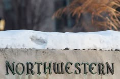 the north western sign is covered in snow