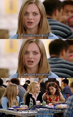 two women sitting at a table talking to each other with the caption if you're from africa, why are you white?