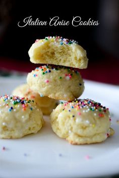 several cookies stacked on top of each other with sprinkles