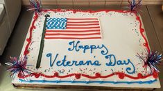 a cake decorated with an american flag and the words happy veterans day