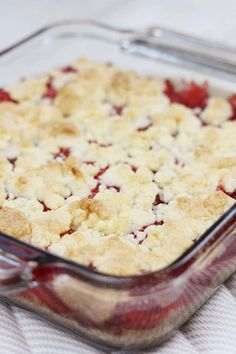 a casserole dish with crumbled toppings in a glass baking dish