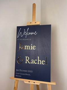 an easel with a welcome sign on it