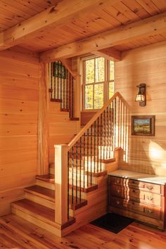 a wooden staircase leading up to the second floor