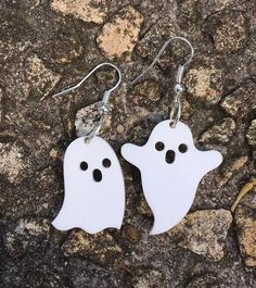 pair of white ghost earrings with black eyes