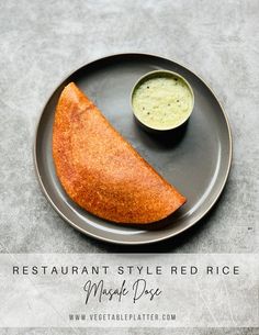 a piece of bread on a plate next to a small bowl of dipping sauce with the words restaurant style red rice mashed potatoes