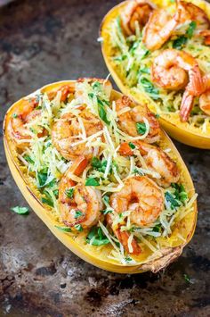 two yellow squash halves filled with shrimp and pasta