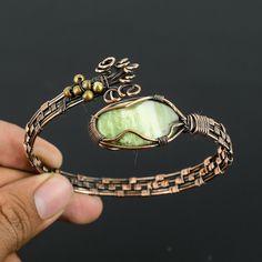 Use 70FORYOU Coupon Code For Get 70% Off On All Items Green Swiss Opal Copper Cuff Bracelet Green Swiss Opal Bangle Copper Cuff Bangle Wire Wrapped Jewelry Handmade Jewelry Adjustable Bracelet   Gemstone :  Green Swiss Opal  Metal : Copper * Protection:- Copper will be tarnished after a while so try to limit contact with lotions, soaps or anything moist and never wear it in the shower, swimming or anywhere else it may come in contact with water. If tarnish becomes an issue, you may clean this item with jewelry cleaning cloth or ultra polishing pads. * Packing:- Your jewelry arrived in a beautiful gift box stored in bubble wrap for safe travel. * Rush your order: Please contact us to see if we can meet your deadline. You can also expedite your shipping in the drop down menu upon check out. Adjustable Metal Crystal Bracelet As Gift, Metal Bangle Crystal Bracelet As Gift, Unique Adjustable Wrap Bangle Bracelet, Adjustable Unique Wrap Bangle Bracelet, Adjustable Wrap Bangle Bracelet, Hand Wrapped Bangle Wrap Bracelet As Gift, Handmade Adjustable Metal Crystal Bracelet, Unique Adjustable Cuff Bracelets, Adjustable Metal Bangle As A Gift