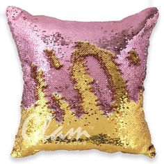 a pink and gold sequinized pillow with the letter q on it