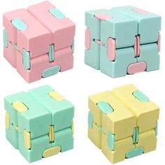 four different colored boxes with handles on them