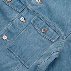 A boxy denim style jacket with articulated chest pockets. Metal shank style buttons at front and cuffs. Embroidered motif on back. Stone washed and bleached denim panelling with contrast colour topstitching. Side panels with set in pockets. Angled back yoke and neat pointed collar. NEED TO KNOW Clean, straight hem Denim style metal shank buttons at front opening and cuffs Large baggy chest pocket with gusset Magic Castles logo detail in silk thread Side panels with pockets Contrast colour topsti Magic Castle, Bleached Denim, Indigo Denim, Shank Button, Denim Style, Knitting Accessories, Silk Thread, Side Panels, Panel Siding