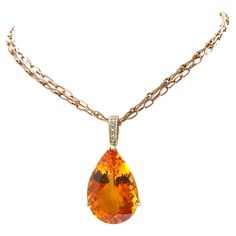 Description Vividly vibrant, exquisitely elegant, magnificently majestic and simply sublime; if this reflects your style, then this necklace is your ideal adornment. The rare flawless 80 carat faceted pear shape Mandarin Citrine radiates rich fiery orange passion. Crowned with a diamond accent, the pendant is seductively suspended from a 14k rose gold double chain enhancing the warmth of the Citrine and creating a spectacular look at any event. Pendant is removable but not sold separately. Item Luxury Orange Round Pendant Necklace, Luxury Orange Spiritual Necklace, Pretty Accessories, Rose Gold Chain, Double Chain, Beach California, Newport Beach, Pear Shape, Pave Diamonds