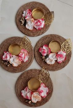 three small baskets with flowers and gold lids