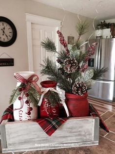 christmas decorations in red and white jars on a kitchen counter