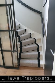 an image of a staircase going up the side of a house with carpeted stairs