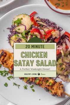 chicken satay salad on a white plate