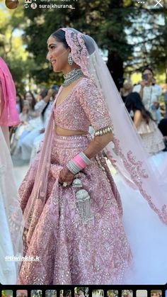 a woman in a pink bridal gown and veil