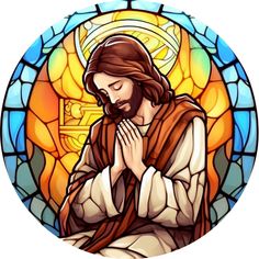 the image of jesus praying in front of a stained glass window