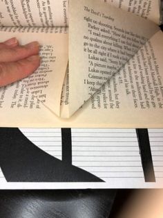 an open book with paper cut out to look like it has been folded in half