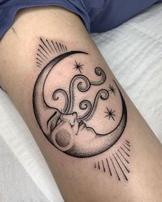 a woman's arm with a tattoo on it and an image of the moon