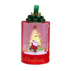 a santa clause snow globe with a christmas tree on top