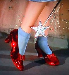 there's no place like home with red shoes and a star on the heel