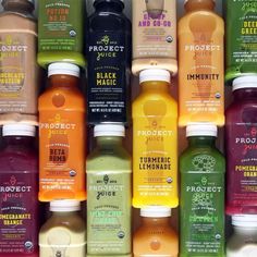 many different types of juices are lined up together