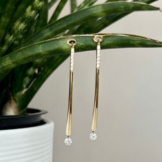 These elongated diamond-accented earrings have a sophisticated style. These earrings are sure to stand out on any occasion since the floating diamonds are always moving and catching the light. The diamonds are of fine (G-H) color and (VS2-SI1) clarity. Bar Metal, Diamond Bar, Modern Bar, Sophisticated Style, Platinum, Floating, Diamonds, White Gold, Bar