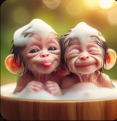 two little monkeys sitting in a bathtub with bubbles on their heads and noses sticking out