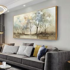 a living room filled with furniture and a painting on the wall