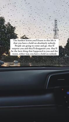 the inside of a car with raindrops on it and a quote about life