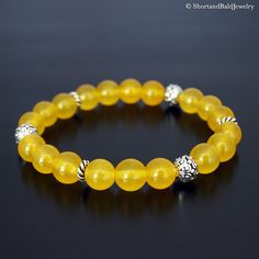 "❖ YELLOW JADE: AAA Quality Natural 8mm gemstone ❖ ♥ Stability ♥ Longevity ♥ Fertility ♥ Serenity ♥ Wisdom ♥ Practicality ♥ Tranquility ♥ Balance ♥ Peace ♥ Harmony ♥ Moderation ♥ Perspective ❖ SPACERS & SILVER BEADS : Antique pewter charms made in USA. ❖ Durable Elastic Stretch Cord. ❖ The gemstones are natural, so you may see some variations. ❖ Your purchase will arrive attractively packaged and ready to give. ❖ Size ❖ Women Small: Fits 5.5\" - 6\" Women Medium: Fits 6\" - 6.5\" Women Large Fertility Bracelet, Howlite Bracelet, Aquamarine Bracelet, Jade Crystal, Yellow Jade, Peace And Harmony, Jade Bracelet, Antique Pewter, Natural Jade