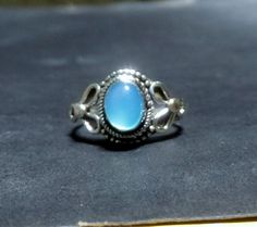 This is a very unique ring of silver with Chalcedony stone This intricate .925 Sterling Silver Ring. You can  give to your loved ones , she or he will be fully surprised to get your  unique ring. Indian handmade silver ring 92.5  Metal     Silver Stone    Chalcedony Stone Size 6 x 8  mm if you have any query contact us thanks for visit our shop                                                        Please don't hesitate to contact us for more information or if you have any questions. Your Feedba Bohemian Silver Rings With Accent Stones, Elegant Silver Turquoise Birthstone Ring, Elegant Silver Turquoise Ring With Birthstone, Dainty Handmade Silver Birthstone Ring, Bohemian Crystal Promise Ring Stamped 925, Handmade Silver Topaz Promise Ring, Handmade Adjustable Silver Topaz Ring, Adjustable Turquoise Cabochon Ring, Luxury Silver Turquoise Cabochon Ring