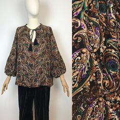 "Bohemian paisley printed blouse  Made in Italy  Brand: Aroma Approx. size: M Material: 100% viscose  In great condition! Measurements: Shoulders: 38 cm - 14,9\" Width armpit to armpit: 70 cm - 27,5\" Sleeve length: 47 cm - 18,5\" Front length: 60 cm - 23,6\" Back length: 68 cm - 26,7\" Any questions - please ask! :)" Patterned Long Sleeve Boho Print Blouse, Bohemian Blouse With Vintage Print For Fall, Fall Patterned Blouse With Boho Print, Bohemian Patterned Tops With Paisley Print, Bohemian Paisley Print Patterned Tops, Fall Bohemian Paisley Print Blouse, Fall Multicolor Paisley Print Blouse, Bohemian Printed Viscose Blouse, Patterned Printed Peasant Top For Fall