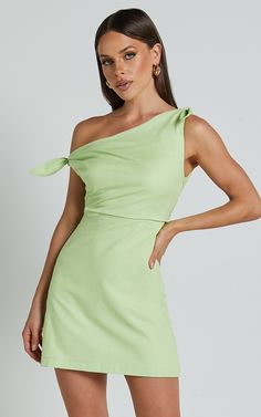 Get ready to turn heads in the Jeofina Mini Dress! This one-shoulder tie dress in a gorgeous celery shade is perfect for any party day or night. Made from a blend of cotton and rayon, this A-line dress is not only stylish but also comfortable to wear. The one-shoulder design adds a touch of sophistication, while the mini length shows off your legs. Whether you're hitting the club or attending a summer soirée, this dress will make you feel confident and empowered. Stand out from the crowd and sho Recruitment Dresses, Formal Fits, A Line Mini Dress, Off The Shoulder Mini Dress, School Dance Dresses, Cute Homecoming Dresses, Hoco Dress, Mini Dress Formal, School Dance