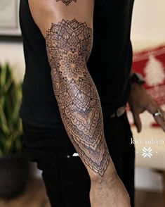 a man with a tattoo on his arm