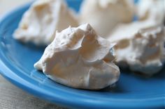 three pieces of whipped cream on a blue plate