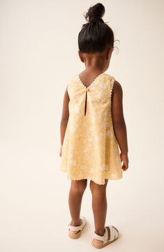 They'll sweeten every occasion in this charming dress designed in a sunny hue and allover blooms. 100% cotton Machine wash, tumble dry Imported Spring Floral Print Sundress For Playdate, Spring Floral Sundress For Playdate, Summer Floral Print Twirl Dress For Playdate, Sleeveless Dress With Smocked Back For Playdate, Cotton Dress With Smocked Back For Playdate, Cotton Twirl Dress With Floral Print For Playtime, Playful Yellow Twirl Dress For Spring, Cute Ditsy Floral Print Sundress, Smocked Baby Clothes