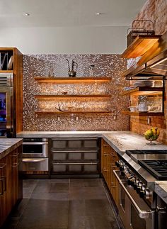 a kitchen with stainless steel appliances and wooden cabinets