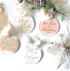 four personalized christmas ornaments with pine cones