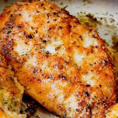 a close up of some chicken on a pan