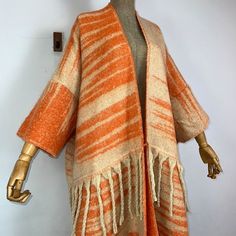 This super soft and warm wool cardigan kimono is perfect for the cold weather. Unlike other sweaters and wools, the wool used for this beauty is non itchy. Think of your favorite throw blanket, the comfort and warmth it gives but 10x stylish and wearable any where. This kimono is all that and more! One size fits S-4X Material: Wool One Size Fits Most Size Chart Cozy Sweater With Shawl Collar For Cold Weather, Cozy Wool Sweater Coat For Winter, One Size Soft Knit Outerwear For Fall, Knitted Cardigan With Shawl Collar For Fall, Knitted Shawl Collar Cardigan For Fall, Cozy Shawl Collar Sweater For Fall, Winter Cashmere Cardigan With Shawl Collar, Cozy Acrylic Outerwear For Fall, One Size Long Sweater For Fall