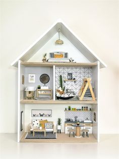 a doll house with furniture and accessories in it