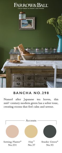 an ad for farrow & ball featuring the kitchen table and countertop with green walls