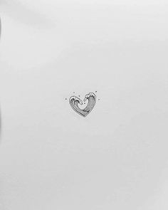 a drawing of a heart on the side of a white refrigerator freezer that is open