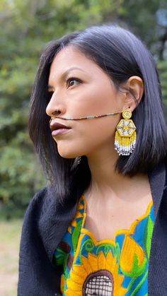 Handmade face ornament with genuine Tiger Eye, turquoise, 925 sterling silver fish hook, and gold plated brass faux septum ring. Our ancestors have used both stones for protection on our journey. To the Mayas, tattoos, and piercings were a sign of strength and also a status symbol. Body art was even more painful then and, therefore more appreciated. *Using a necklace or shoestring, measure ONE SIDE of your face from the septum to your earlobe where the fishhook (piercing) will be inserted. Beads Handmade Bohemian Nose Rings, Turquoise Brass Jewelry For Festivals, Bohemian Gold Nose Rings For Festival, Bohemian Gold Nose Rings Nickel Free, Bohemian Yellow Gold Beaded Jewelry, Yellow Sterling Silver Single Earring, Bohemian Beaded Yellow Gold Jewelry, Bohemian Gold Nickel-free Nose Ring, Gold Bohemian Nickel-free Nose Ring