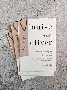 three personalized wedding tags on top of each other