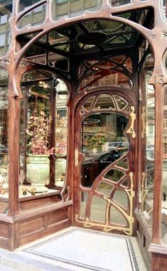 an ornate wooden entrance to a flower shop