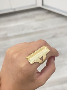 "14K Custom Name Ring -Solid 14K Gold -Beautiful customizable ring, can be engraved with any name or even left blank -Available In a 7 1/2 US size -Dimensions; .50\" W x 1.2\" L -Great for everyday wear or for special occasions -Very unique ring, has a thick plain band perfect for future sizing -Nice framed look on the edges, and a sand paper finish on the inside -(Message us if you have any questions)" Unique Personalized Gold Rings, Personalized Gold Rings With Unique Style, Unique Gold Engraved Promise Ring, Custom Name Engraved 14k Gold Ring, Personalized 14k Gold Rings With Custom Name, Customizable 14k Gold Nameplate Ring, Custom Name 14k Gold Ring For Gift, Silver Nameplate Ring With Custom Name, Bow Ring