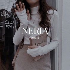 a woman is holding her hand up in front of a window with the words neria on it